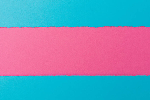 The torn paper forms an abstract background with copy space.