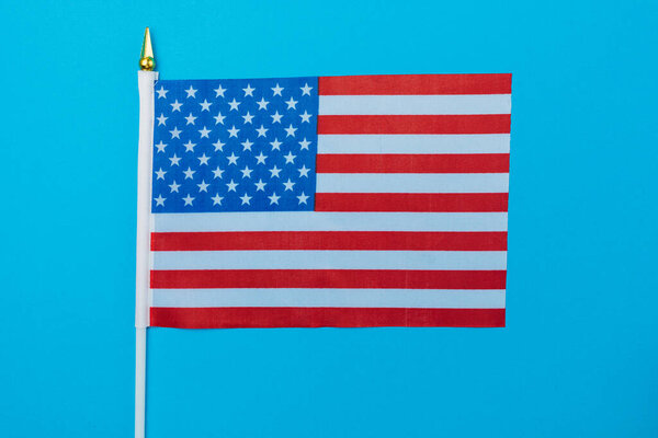 American small flag on colored paper. Abstract background.