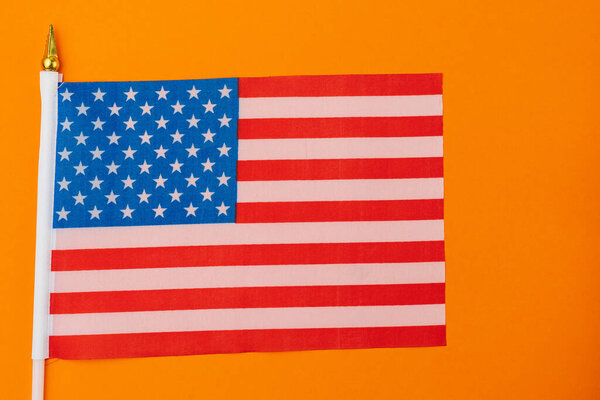 American small flag on colored paper. Abstract background.