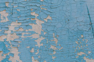 Soyulmuş ve çatlak boyalı Grunge arka planı. Eski bir duvarın desenli yüzeyi