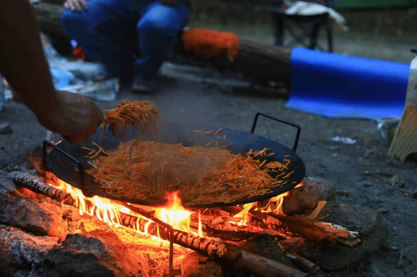 Abstract background on the theme of cooking in a camping or hiking setting. Selective focus with blurred background