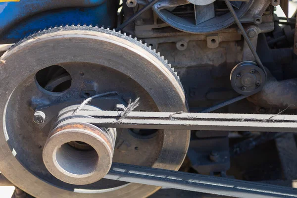 Walk-behind tractor belt. Power transmission mechanism close-up. Background