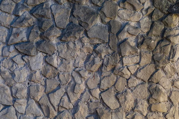 Vahşi Taş Duvarın Kaba Dokulu Yüzeyi Arkaplan — Stok fotoğraf