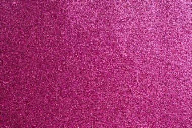 Bir sürü küçük pembe noktalı pembe bir arka plan. Arka plan pembenin derin bir tonu ve noktalar da pembenin canlı bir tonu. İmajın neşeli ve tuhaf bir havası var.