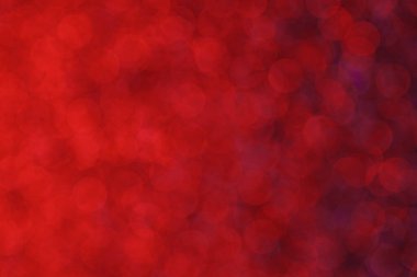 Kırmızı bir zemin ve küçük kırmızı daireler. Çemberler bulanık ve örtüşüyor.