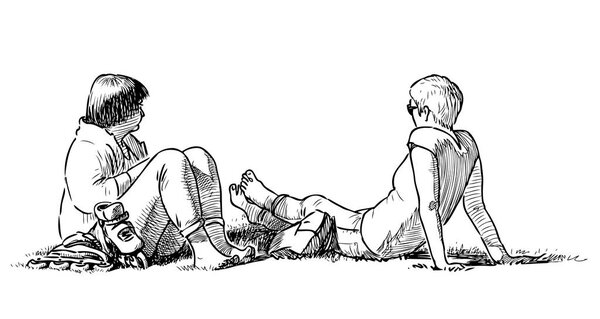 Citizens rest on the lawn in the city park