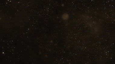 Parlak altın parçacıkları ve parıldayan ışık saçan parlak arkaplan. Gösterişli etkinlikler, ödül törenleri veya yetenek yarışmaları için mükemmel altın arka plan.. 