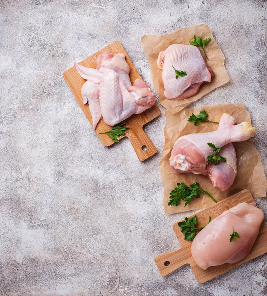 Raw chicken meat fillet, thigh, wings and legs