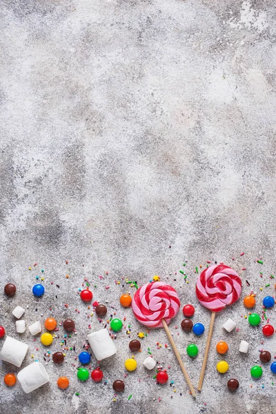 Sweet background with lollipop, candy and  marshmallow