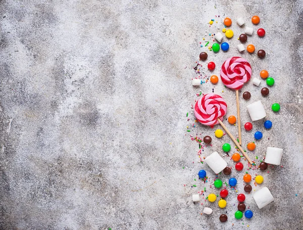 Sweet background with lollipop, candy and  marshmallow — Stock Photo, Image