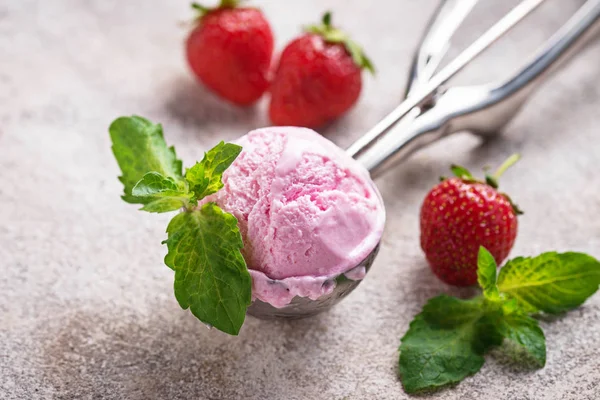 Ball of strawberry Ice cream in scoop