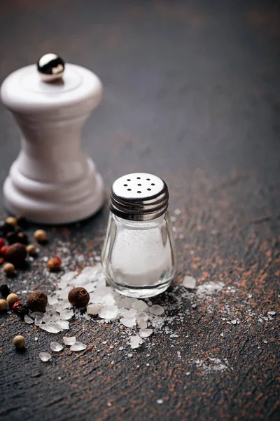 Salt and pepper. Culinary background. Selective focus