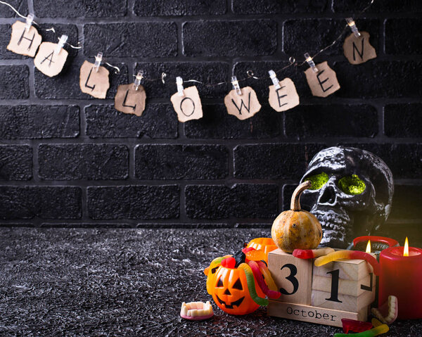  Halloween background with skull and candles 