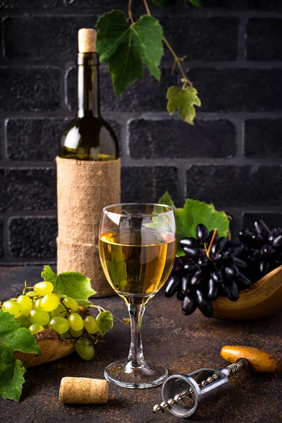 Grape, bottle and glass of white wine