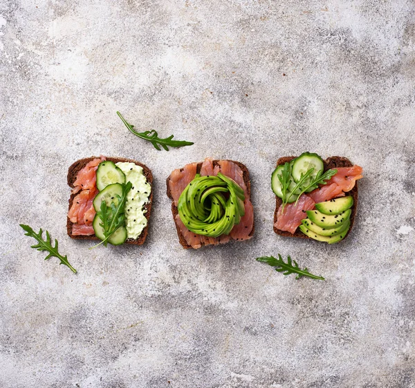 Healthy Toasts Salmon Avocado Rose Top View — Stock Photo, Image