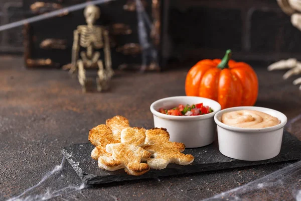 Bread in shape of men and sauces — Stock Photo, Image