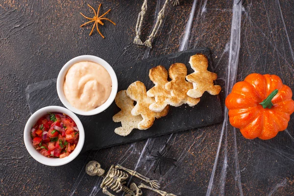 Bread in shape of men and sauces — Stock Photo, Image