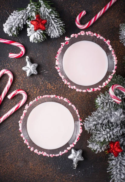 Pink peppermint martini with candy cane rim — Stock Photo, Image