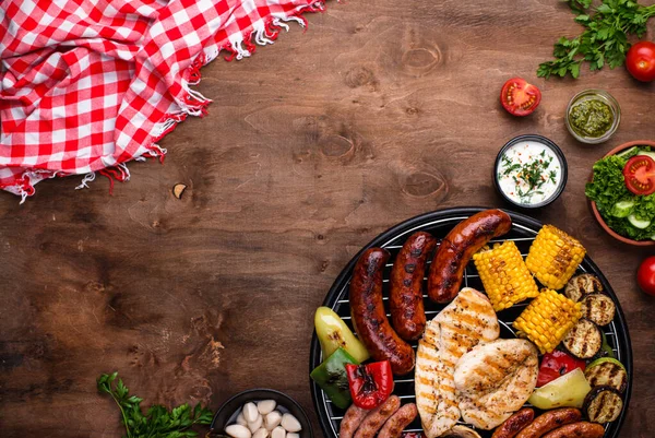Grilled sausages, meat, and vegetables. — Stock Image Grilled sausages, meat, and vegetables. Stock Photo