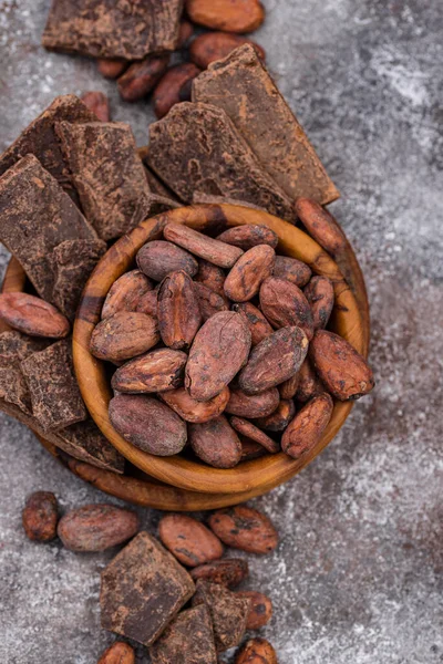Natural cocoa powder, cocoa beans and chocolate — Stock Photo, Image