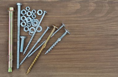 Several various metal fasteners for construction clipart