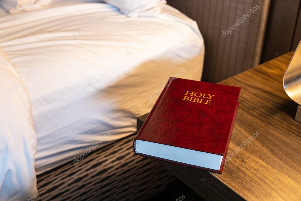 Bible in hotel room on night stand