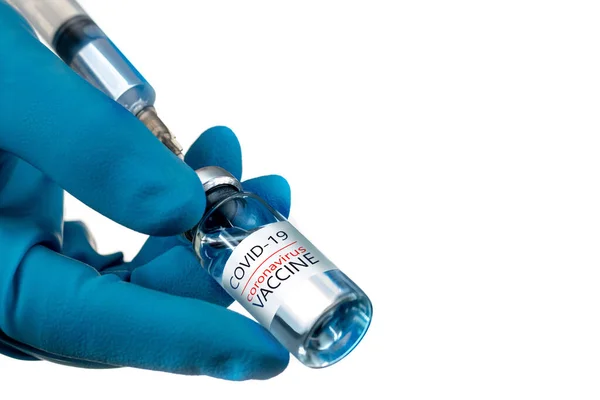 Coronavirus aşısı COVID-19 'un geliştirilmesi ve yaratılması. Coronavirus aşısı kavramı doktor mavi aşı kavanozunun elinde. Aşı Coronavirus 'a karşı savaş kavramı.
