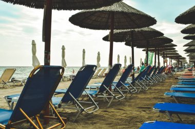 empty beach beds at the sea because of pandemic travel ban