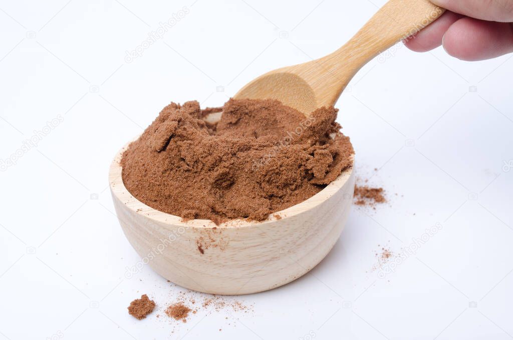 Cocoa powder on wood bowl