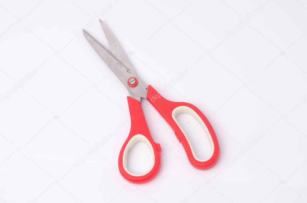 Scissors red on white background