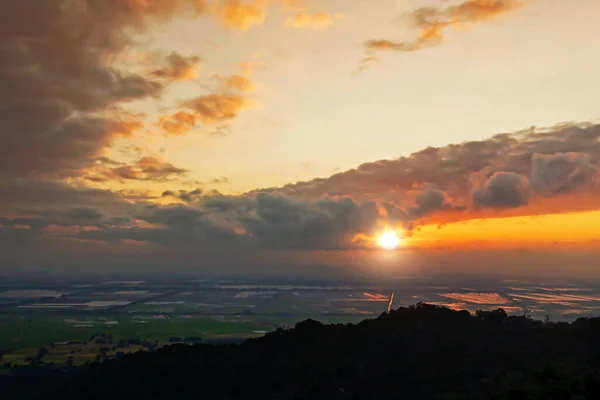 At the top of the mountain, look at the sun rising up in An Giang, Vietnam.