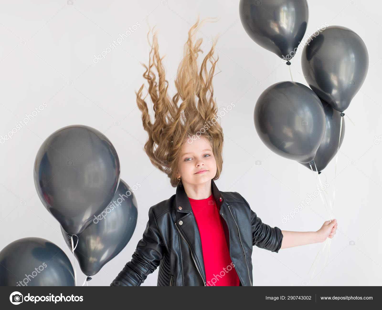 Blond Model With Curly Hairstyles In A Black Leather Jacket And
