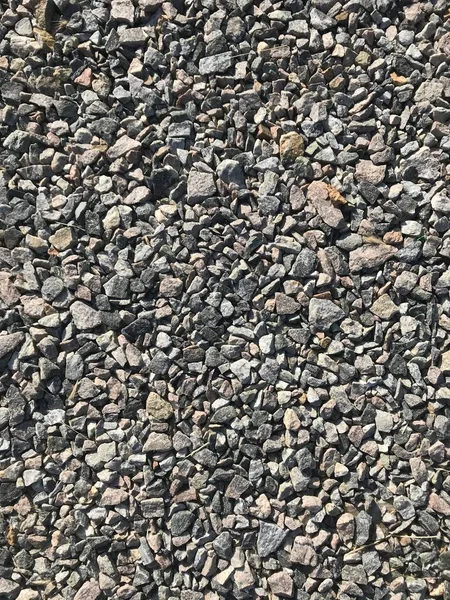 灰色の背景色花崗岩の瓦礫 — ストック写真