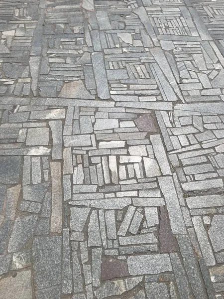 Grijze achtergrond textuur granieten vloer van stukken steen — Stockfoto