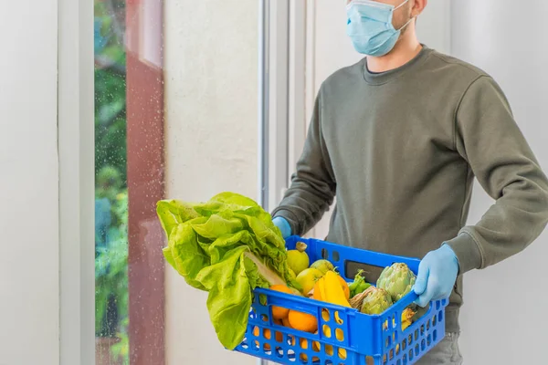 Coronavirus. Home delivery food during virus outbreak, coronavirus panic and pandemics. Home delivery food, vegetables and fruit. Stay at home. Order online. Express delivery service.