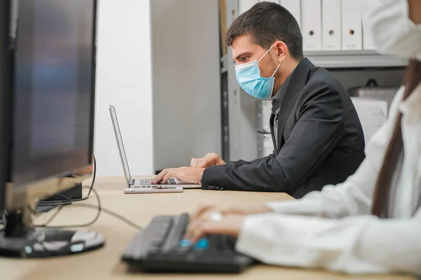 Business workers working in small company with computers. Small company working and doing business. Small company and team work concept. Little office. Home working during quarantine. Coronavirus.