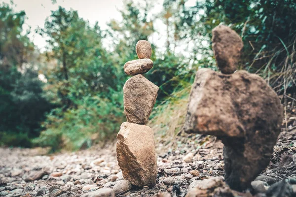 Stone balance rocks in zen garden. Meditate spiritual landscape of green forest. Rock balancing.
