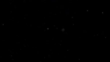 Siyah arkaplanda süzülen parlak parçacıklar. Yüksek kalite 4k görüntü