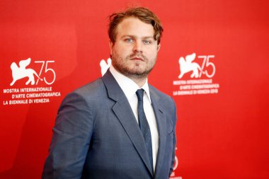 VENICE, ITALY - SEPTEMBER 04: Brady Corbet attends the photo-call of the movie 'Vox Lux' during the 75th Venice Film Festival on September 4, 2018 in Venice, Italy.  clipart