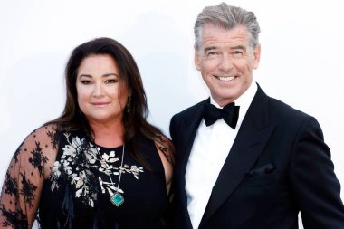 CAP D'ANTIBES, FRANCE - MAY 17:  Pierce Brosnan and Keely Shaye Smith arrive at the amfAR Gala Cannes 2018 at Hotel du Cap-Eden-Roc on May 17, 2018 in Cap d'Antibes, France. clipart