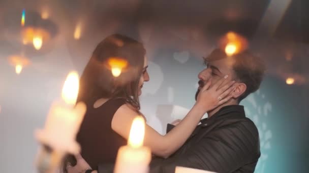 Intimate Moment On Loving Couple, suave abrazo, Young romantic lovers intimate moments - Intimacy and love relationship concept, on the background of candles. — Vídeos de Stock