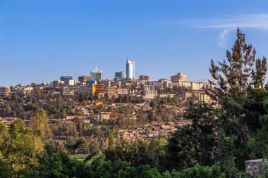 Rwandan capital downtown ladscape with living houses and business buildings, Kigali, Rwanda clipart