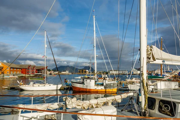 Yachts and boats with mountain in the background at pier in Svol