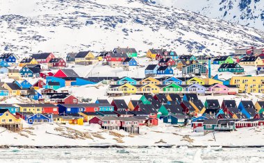 Arctic city center panorama with colorful Inuit houses on the ro clipart