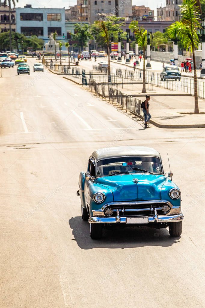 Old vintage blue retro car on the road in the center of Havana, 