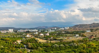 Lefka town panorama with modern buildings and green residential 