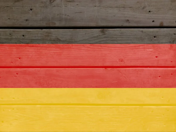 Germany flag painted on wood plank background. Brushed natural light knotted wooden board texture. Wooden texture background flag of Germany