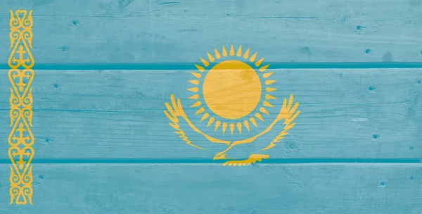 Kazakhstan flag painted on wood plank background. Brushed natural light knotted wooden board texture. Wooden texture background flag of Kazakhstan