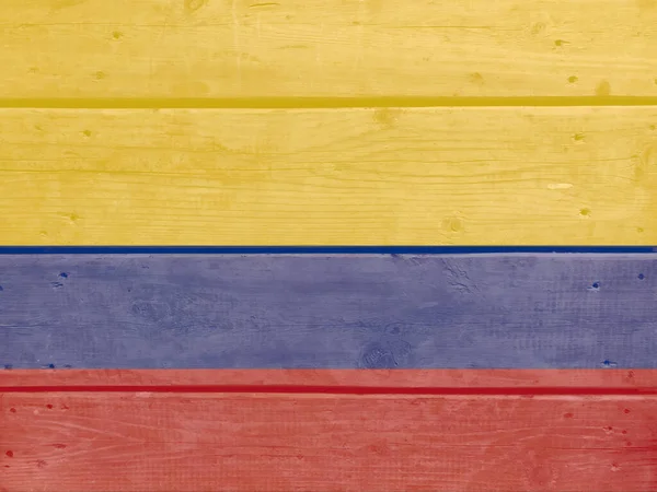 콜롬비아 국기가 널빤지 배경에 그려져 자연광 질감을 닦았다 콜롬비아의 — 스톡 사진