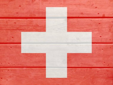 Tahta zemine İsviçre bayrağı çizilmiş. Fırçalanmış doğal ışık düğümlü ahşap tahta doku. İsviçre 'nin ahşap arkaplan bayrağı